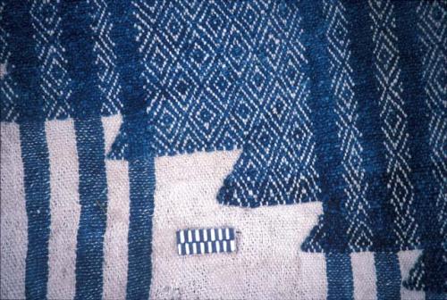 Textile with diamonds and stripes from Site 19