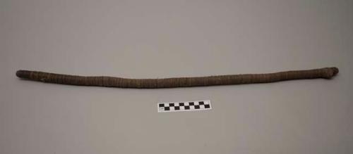 Wood stick wrapped lengthwise with sinew