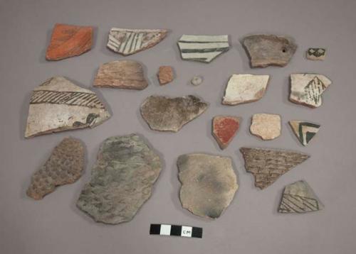 Ceramic body and rim sherds, one faceted quartz bead