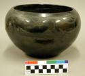Ceramic bowl, antelope design on body, black on black.