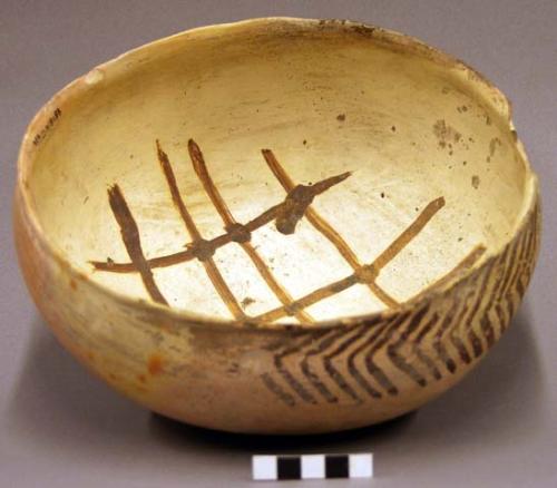 Ceramic bowl, slightly flared chipped rim, red on buff interior and exterior