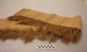 Piece of striped grass cloth with fringes - tan color with red and brown stripes