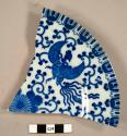 Rim sherd from a plate, blue and white floral and bird design - "MADE IN / JAPAN".