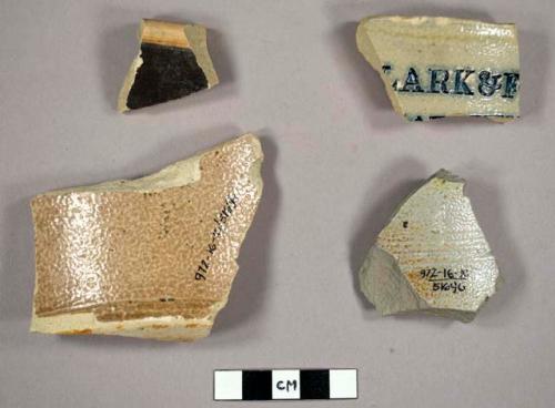 Stoneware sherds, glazed. One with writing on it:"...LARK & F..."