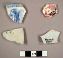 Sherds of earthenware pottery, glazed. Four are plain, eight are patterned.