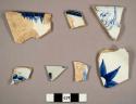 Blue and white patterned stoneware and china sherds, rims and bases. some flora