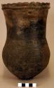 Ceramic vessel, slightly flared & punctate neck, shell temper, rounded base.