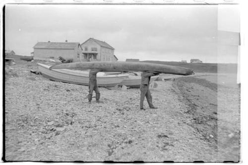 Men carrying a kayak