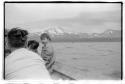 Small boy on boat with others