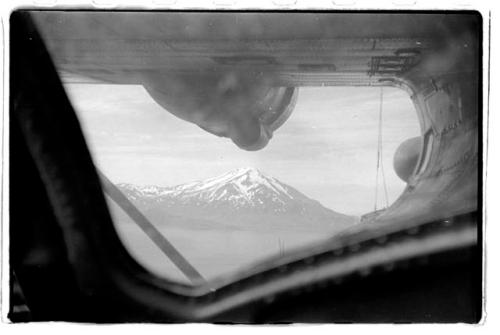 Mountain through airplane window