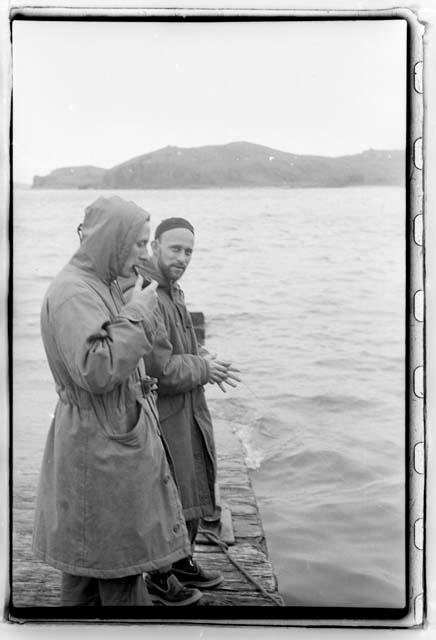 Men of the expedition casting from dock