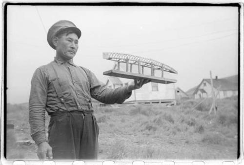 Man holding model boat