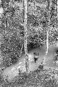 Woman crossing river