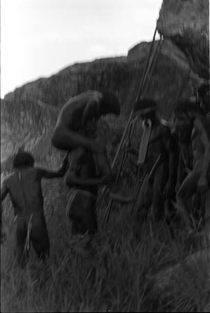 Tekman Biok being carried by his comrades