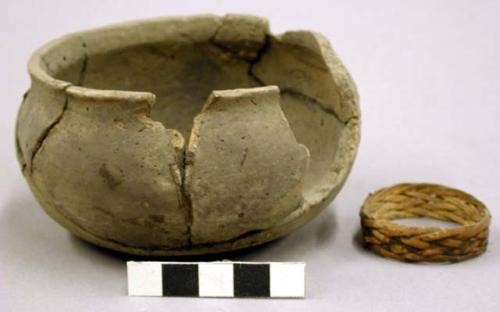 Small pottery jar with woven reed ring inside