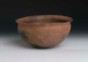 Pottery cooking bowl. Outcurving rim, brown with mica or iron pyrites, no slip,
