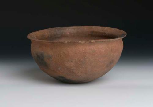 Pottery cooking bowl. Outcurving rim, brown with mica or iron pyrites, no slip,