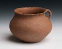 Pottery cooking vessel. Globular with slightly outcurved fluted rim, handle