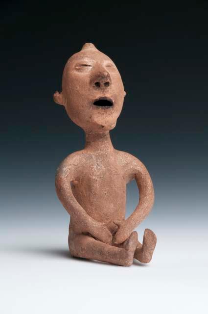 Seated pottery figure, "rain god"