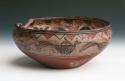 Pottery bowl. Flat base, incurved rim. Decorated with scalloped curvilinear co
