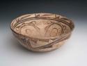 Large pottery bowl--diameter 15.25", concavity in base, cream with brown and ora