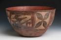 Large pottery bowl. Red ware decorated red and brown on cream slip.
