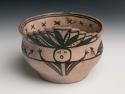 Small pottery bowl. Portion of rim higher and terraced