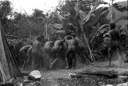 Four boys outside the hunu