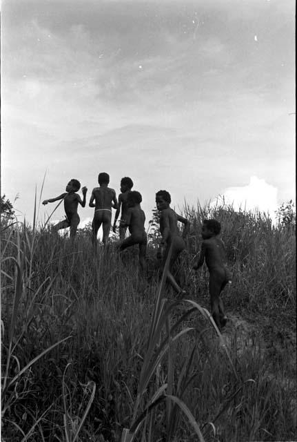 Boys walking up a hill