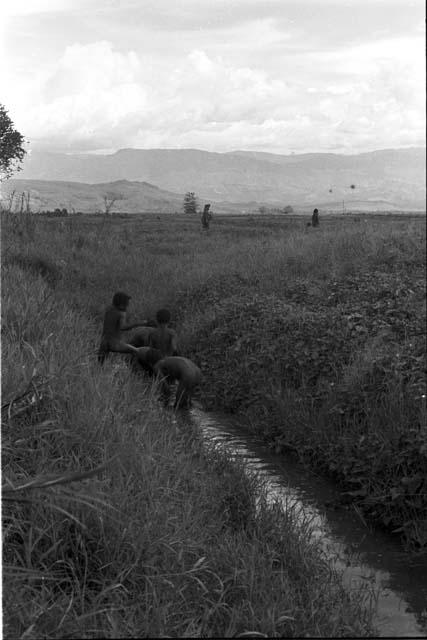 Boys in a ditch