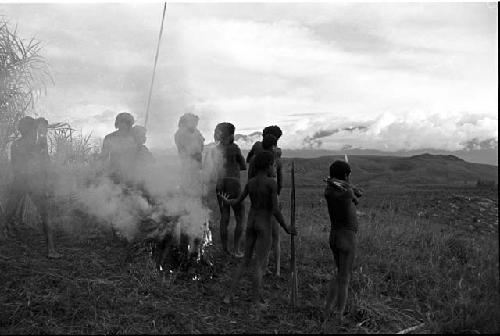 Men at a fire on the Warabara