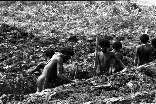 Men work in a ditch