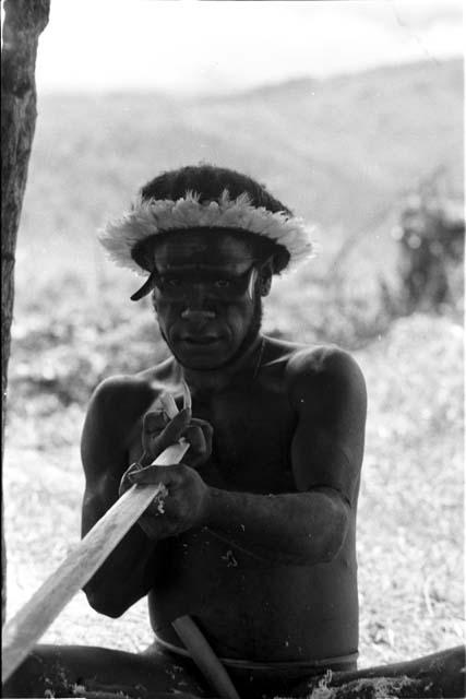 Yegé Asuk working on his spear