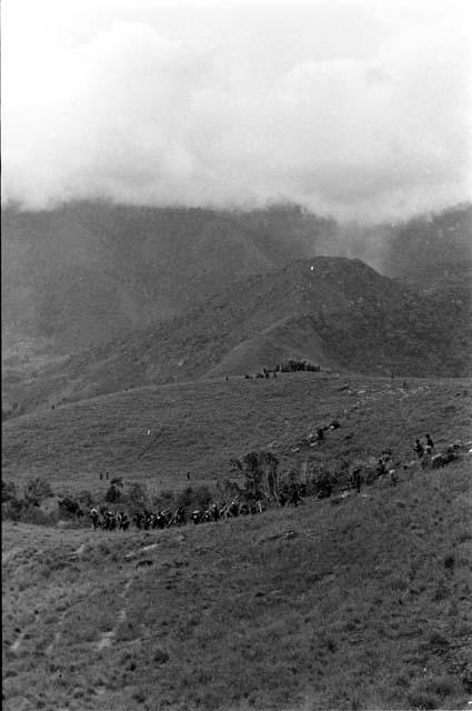 Men moving towards the front