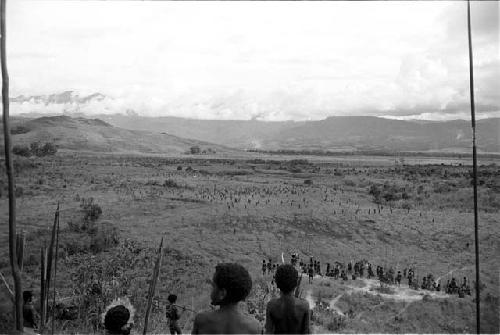 Men watch the battle