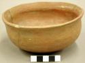 Ceramic bowl, red burnished surface, slightly flaring rim, repaired