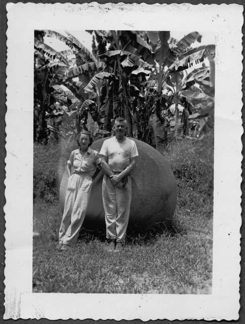 Samuel K. Lothrop and Eleanor Lothrop in front of stone ball