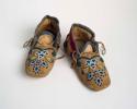 Pair of Ponca child's moccasins. Square toed, with beadwork & cloth trim