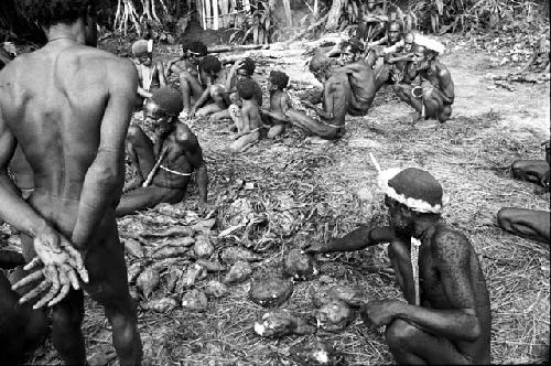 the haksé is being opened in the back sili; the sweet potatoes being brought out