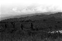 men standing up running towards the Warabara