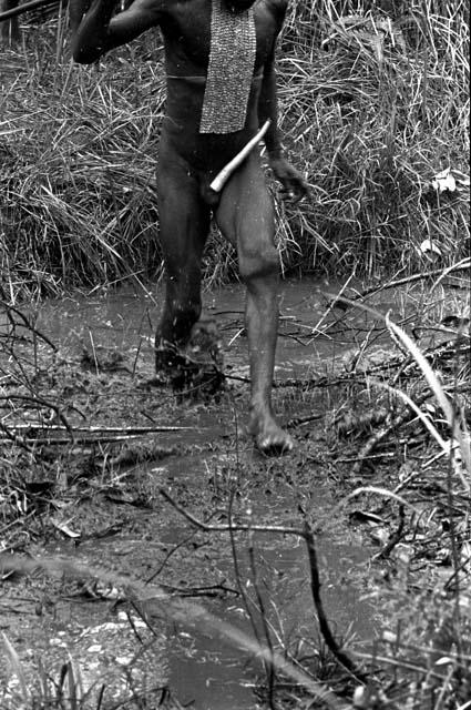 a man splashes across a great deal of mud