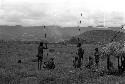 men near the olea watch out in the direction of the Warabara