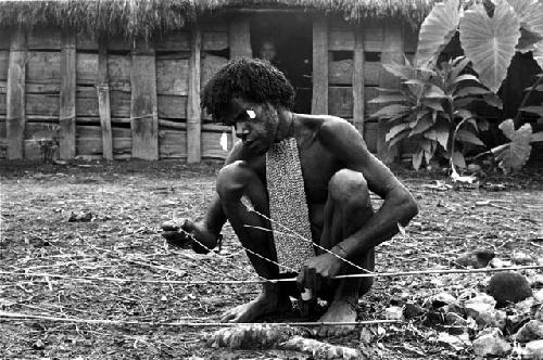 Wali prepares the hola ceremony - to help cure Yegé Asuk