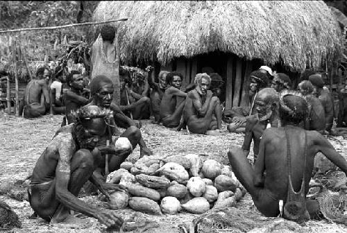 men arranging a pile of hiperi