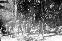 men carrying hot stones