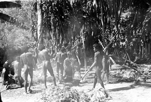 men carrying hot stones