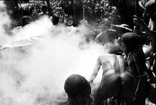 man putting meat into the hakse