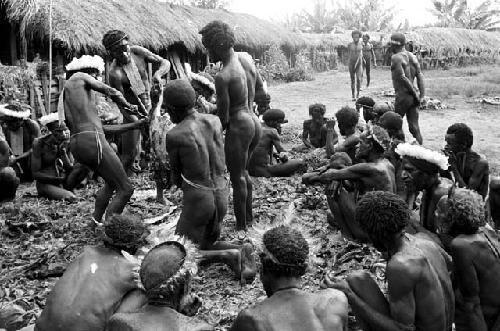 men cutting pig meat