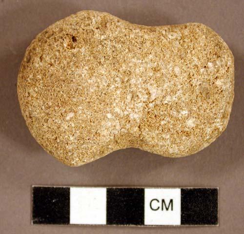 Ground stone, pecked and ground stone object, possibly notched