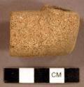 Ground stone, elbow pipe fragment